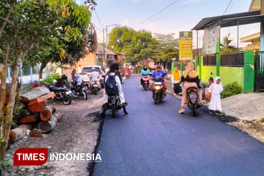 Akhirnya Jalan Dusun Curah Lembu Diaspal pada TMMD di Jember